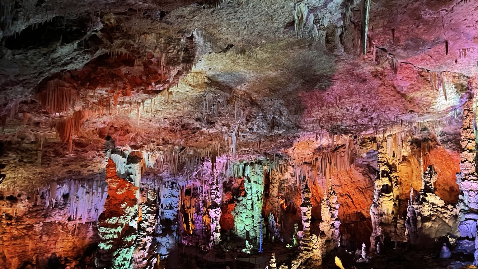 The illuminated formations inside Grotte de la Salamandre