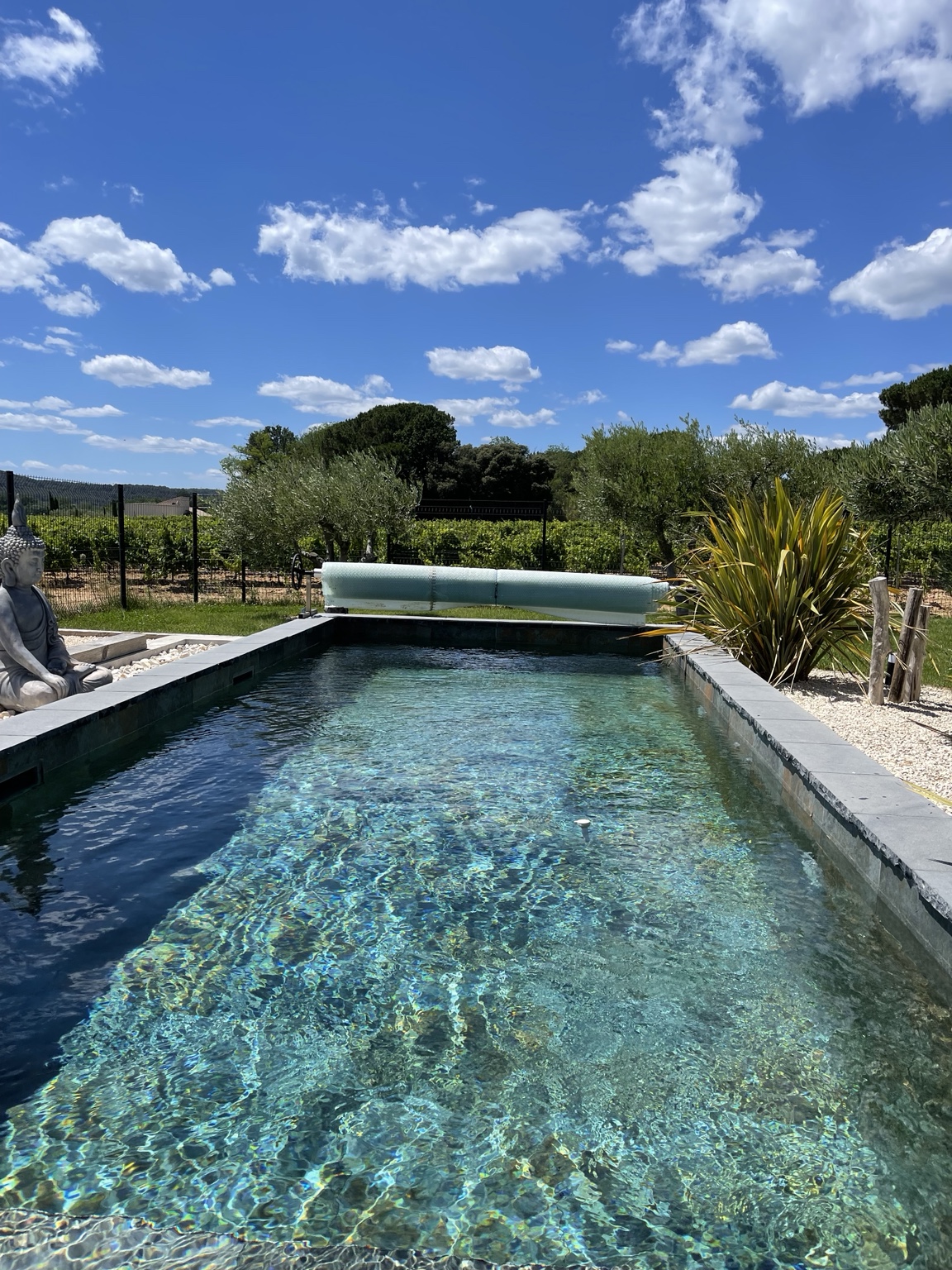 The Balinese-style pool beneath the Provençal sky